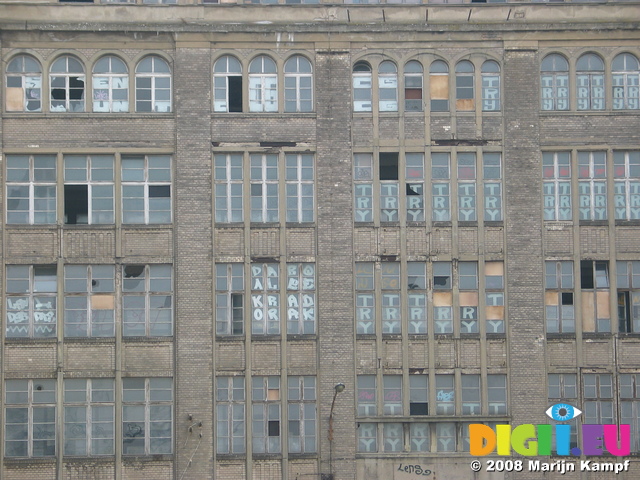 25008 Writing on windows of abandoned building